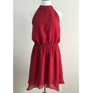 Pins and needles red dress with open back and bow